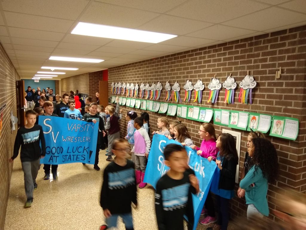 a parade of seneca valley wrestlers as they head to the state tournament.